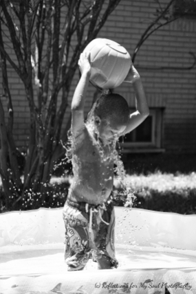 Pouring water on himself!